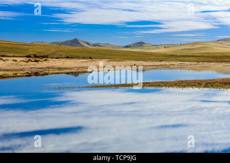 On the dam, lakes, hills, autumn colors Stock Photo