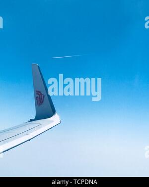 A flying plane, close-up. Stock Photo
