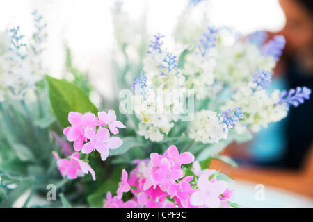 photo of bouquet of artificial flowers on the table Stock Photo