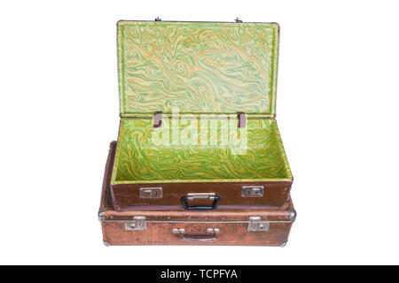 old brown soviet fiber suitcases one on top of other isolated on white background Stock Photo