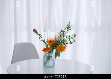 Chair behind the curtains in the living room Stock Photo