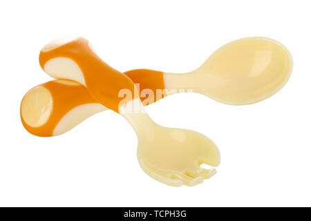 Small beige spoon and fork for babies isolated on white Stock Photo