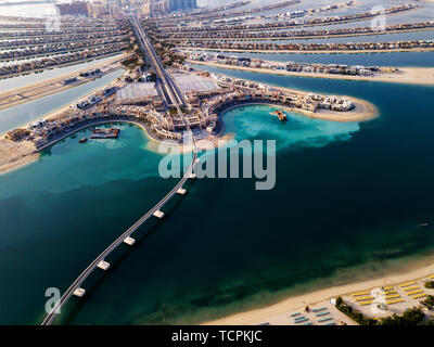 The Palm monorail track leading into the island in Dubai aerial view Stock Photo