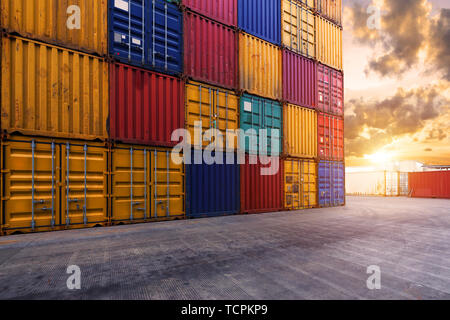 stack of containers with empty road in front Stock Photo