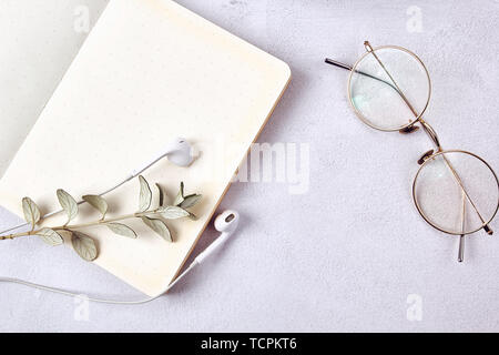 Glasses and books on the desk. Stock Photo