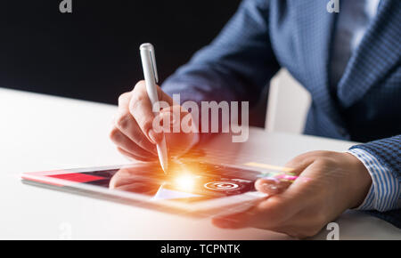 Businessman analysis trading diagram at tablet