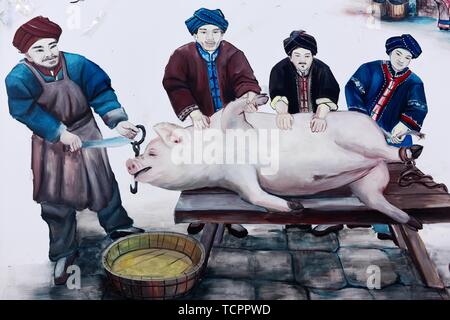Rural Tujia pig killing folklore mural Stock Photo