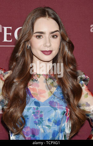 LOS ANGELES, CA - JUNE 08: Lily Collins attends Les Misérables Photo Call at Linwood Dunn Theater on June 08, 2019 in Los Angeles, California. Stock Photo