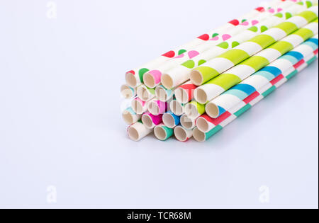 Paper straws bundled up on a white background Stock Photo