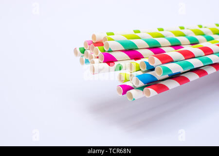 Paper straws bundled up on a white background Stock Photo