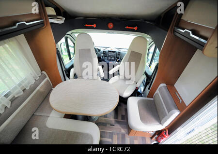 Camper Cabin Interior With Rotating Seats in Recreation Vehicle Stock Photo