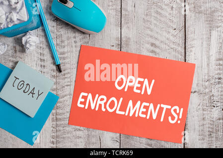 Handwriting text writing Open Enrolments. Conceptual photo when employees may make changes to elected fringe benefit Crumpled paper in bin and compute Stock Photo