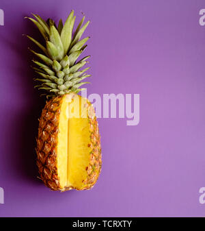 pineapple on deep purple pink background Stock Photo