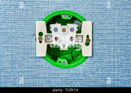 Installation of electrical contact points at home, inside there is view of power outlet socket. Stock Photo