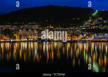 Bergen harbour illuminated at night with Mount Floyen in the background, the best viewpoint of the city. Bergen, Norway, August 2018 Stock Photo