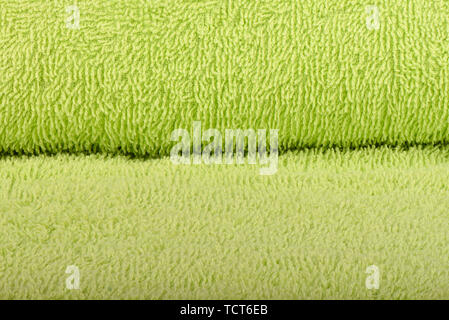 Green terry towel. The texture of the cloth towels. Close up Stock Photo