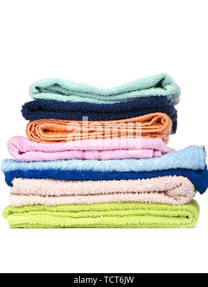 A stack of multi-colored terry towels isolated on a white background. Close up. Copy space Stock Photo