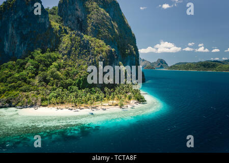 Unique beauty of tropical Pinagbuyutan Island and white sand ipil beach in blue ocean El Nido, Palawan, Philippines. Aerial view Stock Photo