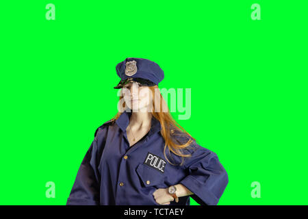 Red haired teen dressed in police uniform and cap isolated on white with copy space. Stock Photo