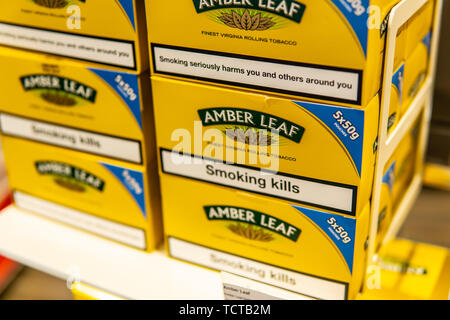 Geneva, Switzerland, March 03, 2019 shelves with Amber Leaf tobacco, lusts  health of man and nature, Amber Leaf brand Rolling Tobacco, Smoking kills  Stock Photo