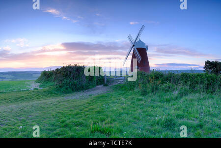 Halnaker, UK - May 10, 2019:  Sunset on the windmill at Halnaker Hill near Goodwood and Chichester in West Sussex, UK Stock Photo