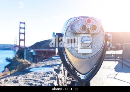 Camera with gold gate bridge over water Stock Photo