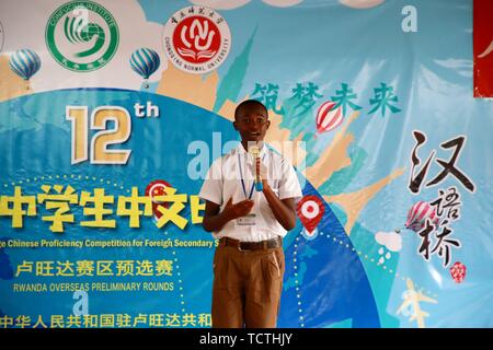 Kigali, Rwanda. 9th June, 2019. A Rwandan student gives a speech in Chinese during the overseas preliminary rounds of the 12th 'Chinese Bridge' Chinese Proficiency Competition for Foreign Secondary School Students, in Kigali, capital of Rwanda, June 9, 2019. Rwanda's secondary school students from different parts of the country participated in the competition in Kigali on Sunday. Credit: Lyu Tianran/Xinhua/Alamy Live News Stock Photo