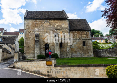 The historic Saxon St Laurence Church on a spring afternoon with a couple of people in the doorway Stock Photo