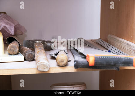 Carpenter's tools on the shelf. Saw, hammer, chisel, and so on Stock Photo