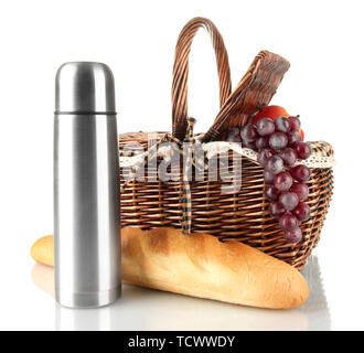 Picnic basket with fruits,bread and thermos isolated on white Stock Photo