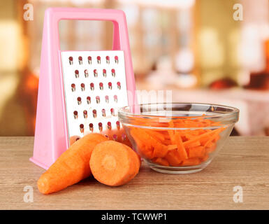 https://l450v.alamy.com/450v/tcwwp1/carrots-with-grater-on-table-in-kitchen-tcwwp1.jpg
