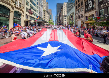 New York, USA. 09th June, 2019. The 62nd Annual National Puerto Rican Day Parade continue the tradition of celebrating the best of Puerto Rican culture and music while paying tribute to the heroes that contributed to the recovery, rebuilding and renewal efforts since Hurricane Maria. The Parade also announced several distinguished Puerto Ricans honorees to march up Fifth Avenue on June 9, 2019. Credit: Erik McGregor/Pacific Press/Alamy Live News Stock Photo