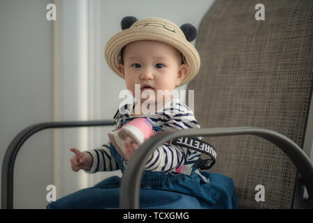 Nine-month-old toddler takes photo on cruise ship trip Stock Photo