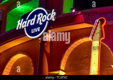 Orlando, Florida. February 05, 2019.  Hard Rock Live sign and partial view of guitar on colorful building background in Citywalk at Universal Studios Stock Photo