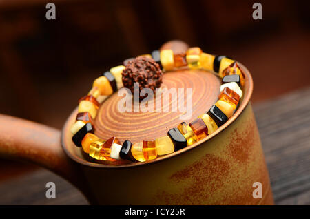 Amber beeswax bracelet Stock Photo