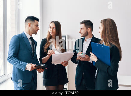 Young business people discussing new business project in office. Brainstorming teamwork Stock Photo