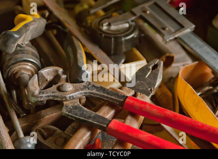 Collection of vintage carpentry tools on an old workbench: woodworking, craftsmanship and handwork concept, flat lay Stock Photo