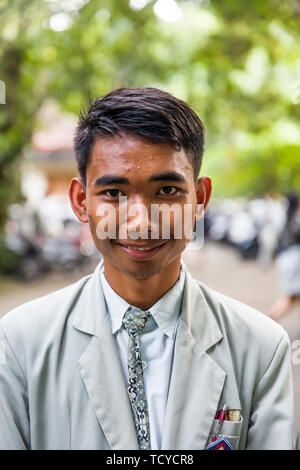 Unindentified high school student on the street of Ubud on Bali island, Indonesia Stock Photo