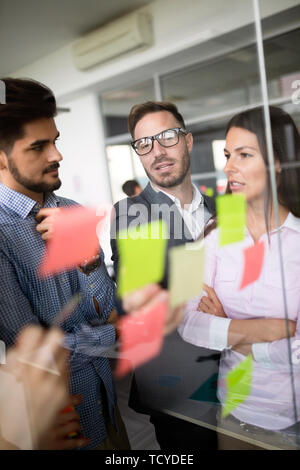 Business people meeting at office and use post it notes to share idea Stock Photo