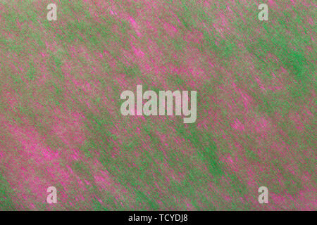 Structure of dark green background with purple spots of felt fabric, closeup. Texture of woolen matt textile. Cloth backdrop. Stock Photo