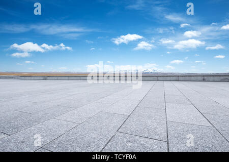 Empty marble floor with snow mountains Stock Photo