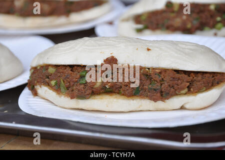 Loaf cake with meat sauce. Stock Photo