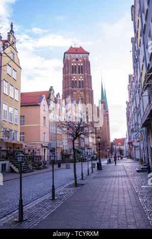 Gdansk, Poland - February 06, 2019: Piwna street and view on the St Mary's Basilica Tower. Gdansk, Poland Stock Photo