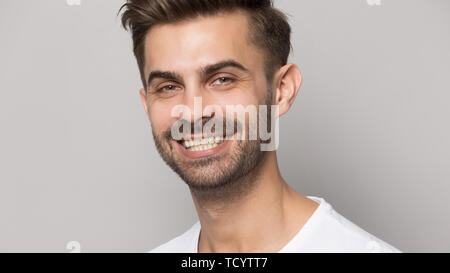 Closeup portrait young man with white toothy smile Stock Photo