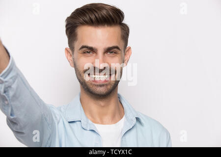 Guy using smartphone view from web camera isolated on white Stock Photo