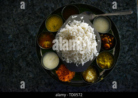 A traditional South Indian Thali dish served in a restaurant in Tamil Nadu, India. Stock Photo