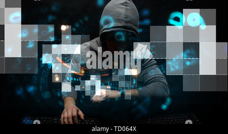 Hacker in hoodie dark theme Stock Photo