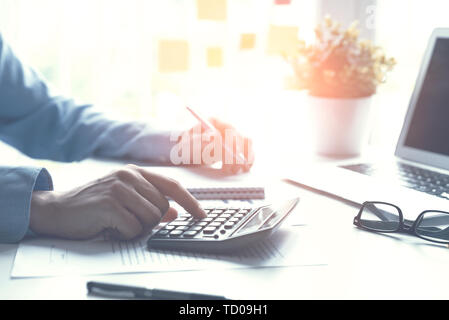 Accountant counts tax, works in the office. Business and finance concept Stock Photo