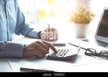 Accountant counts tax, works in the office. Business and finance concept Stock Photo