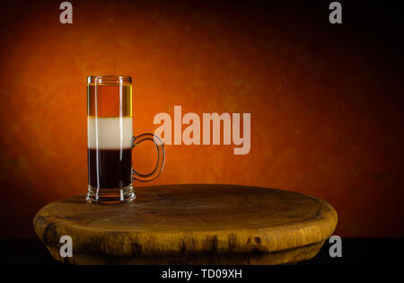 Alcoholic cocktail shot B52 on wooden tray Stock Photo